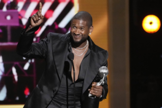 Usher wins the prestigious Entertainer of the Year award at the 55th annual NAACP Awards.